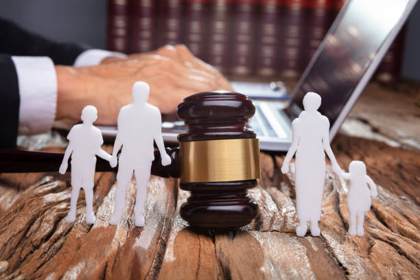 Separation Of Family Silhouette With Gavel In Courtroom